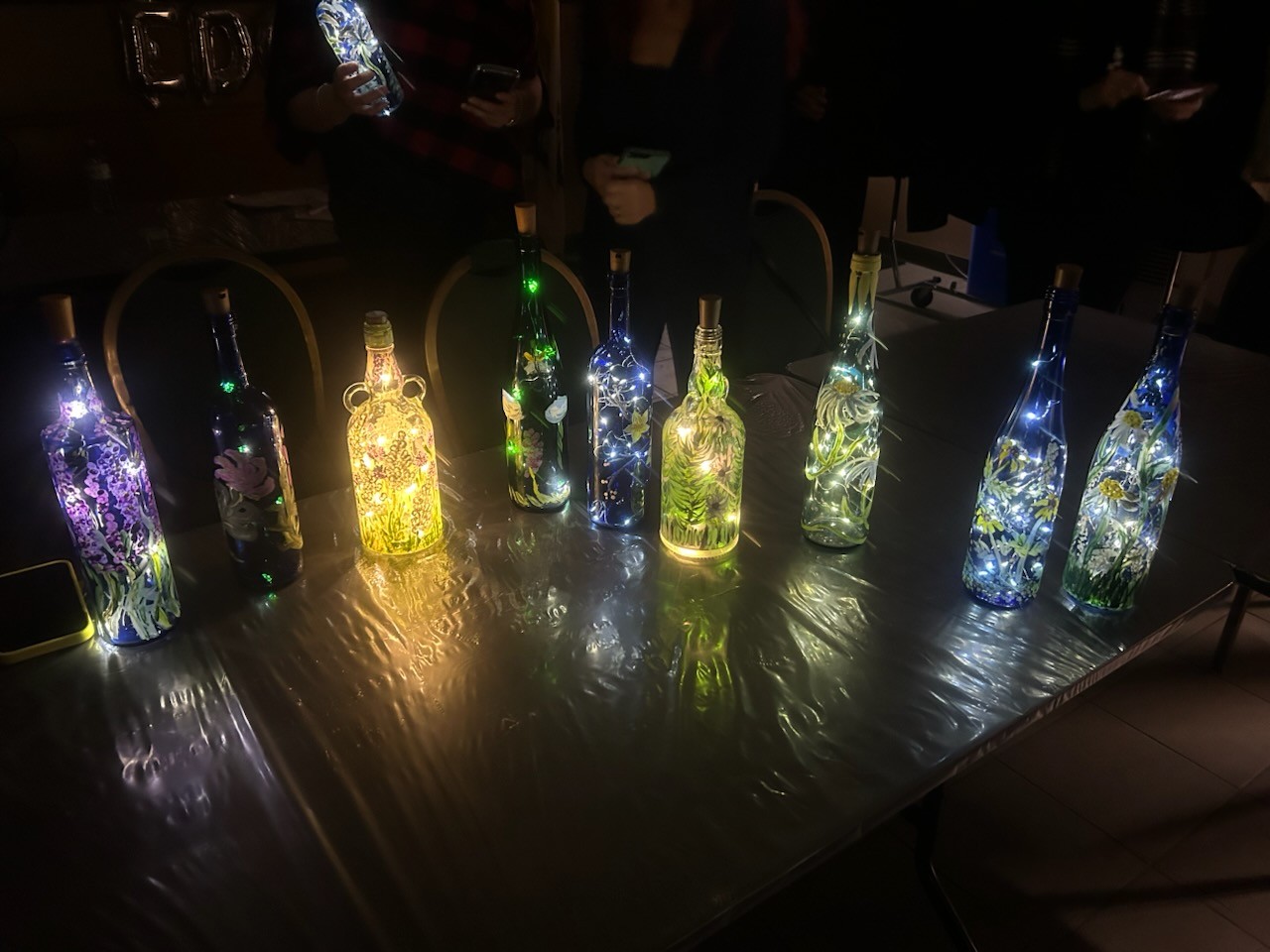 First set of blue painted bottles with lights