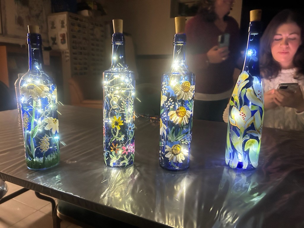 Second set of blue painted bottles with lights