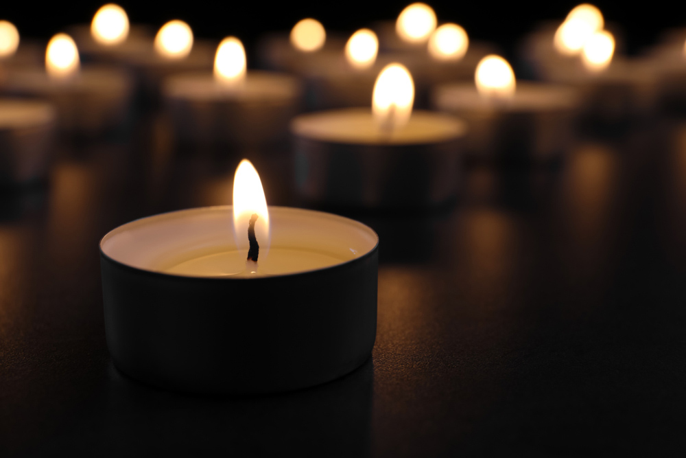 Multiple lit votive candles