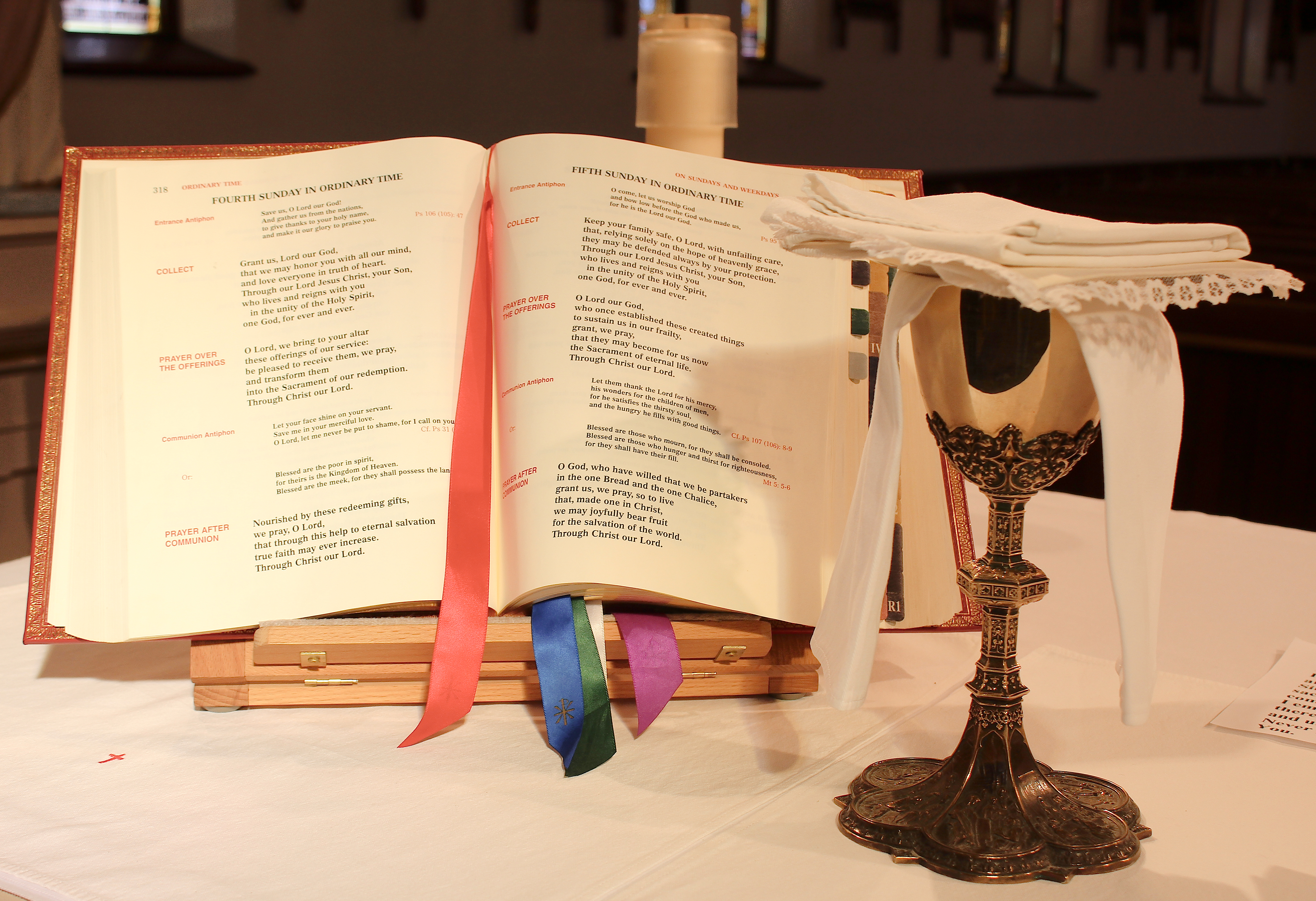 An open lectionary and chalice on an Altar